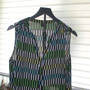 Pre owned Worthington Size L black blouse with line patterns.